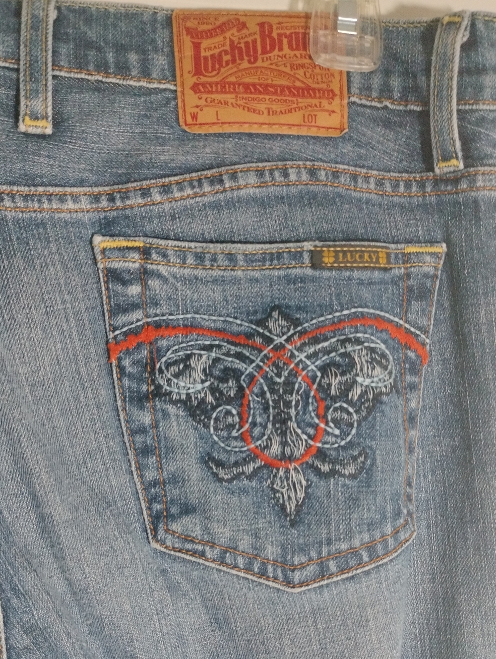 Lucky Brand Blue Denim Jeans. Mid-Rise With Red and White Embroidered Pockets